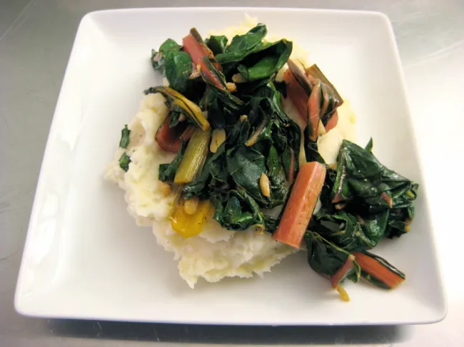 chard with garlic and lemon over mashed potatoes