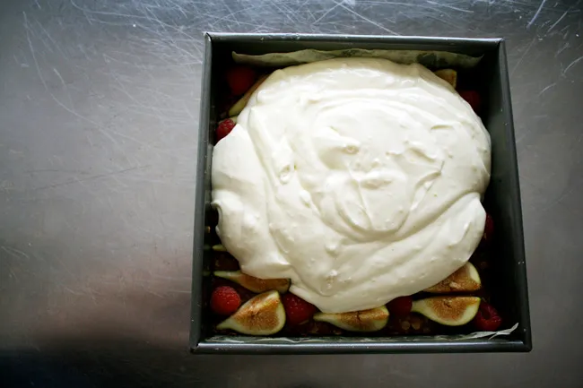 cheesecake batter over figs and raspberries