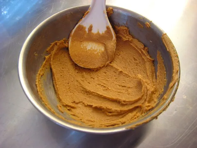 mixing peanut butter with sugar