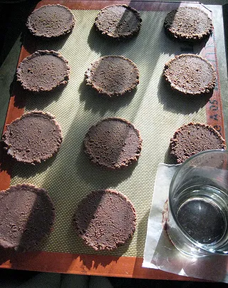chocolate cookie dough, scooped and pressed flat with a glass and waxed paper