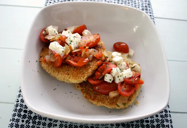quinoa cakes with tomatoes, mozzarella, and basil